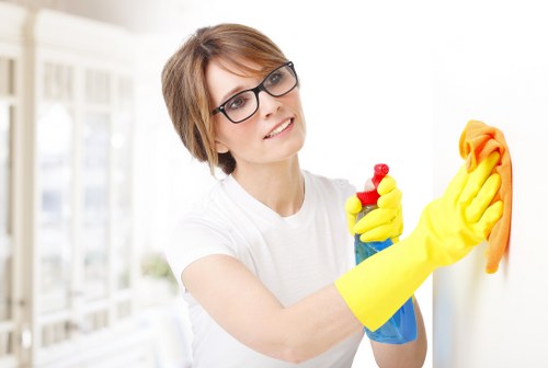 Technician managing wet floor hazards during carpet cleaning