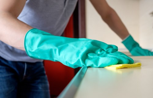 Professional cleaning of shared workplace surfaces and washrooms