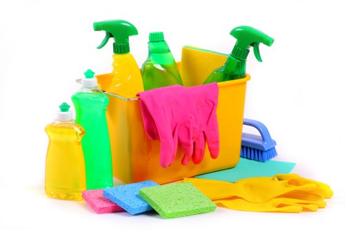Cleaner wiping surfaces in a Collierswood flat before new occupants move in
